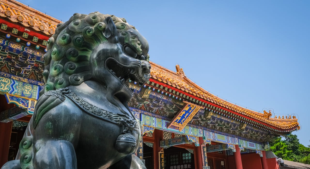 Close view of Foo Dog statue and traditional Chinese architecture at Beijing